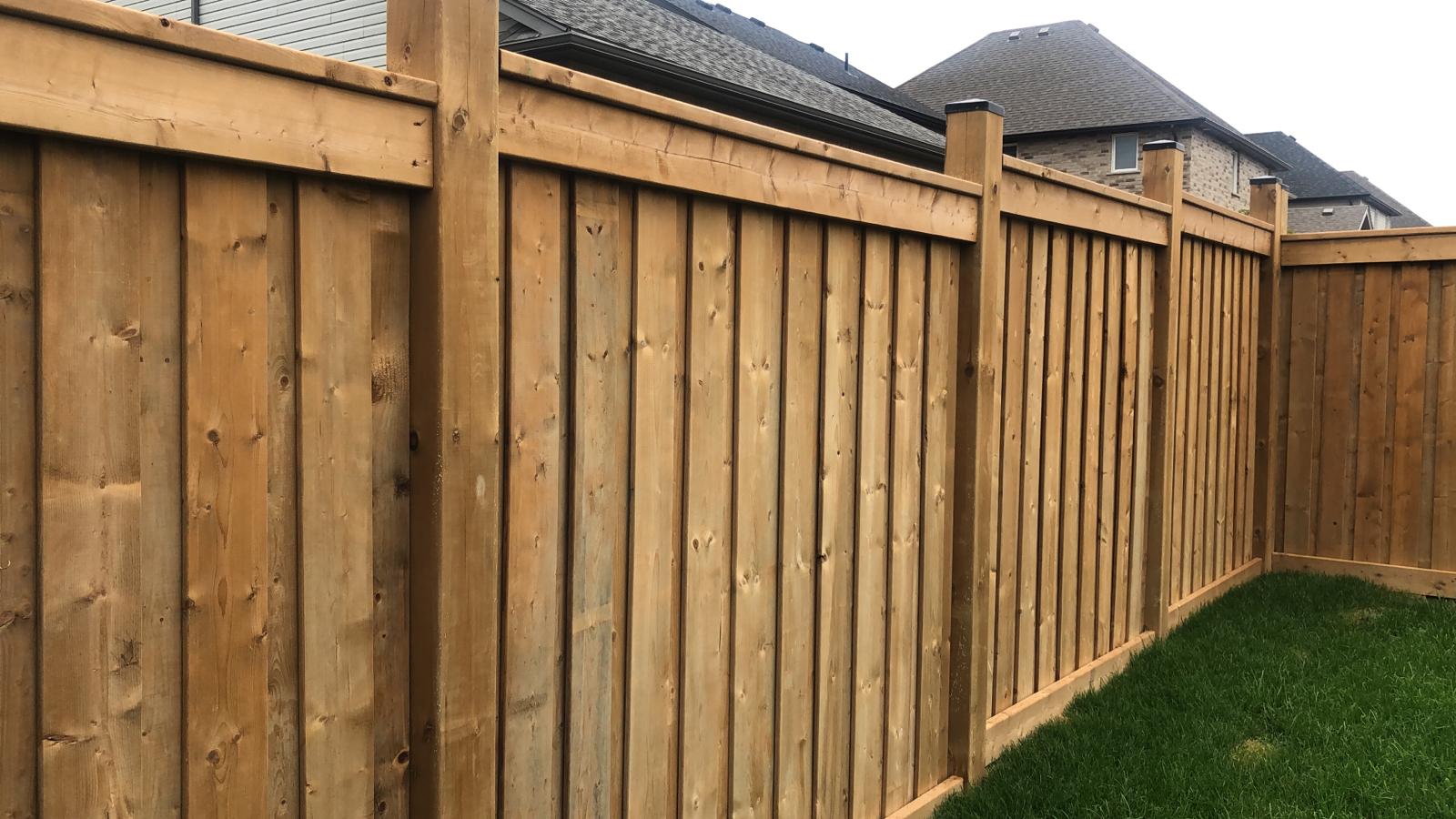Board-on-board wood privacy fence