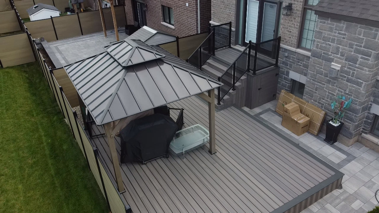 Composite deck with glass railings