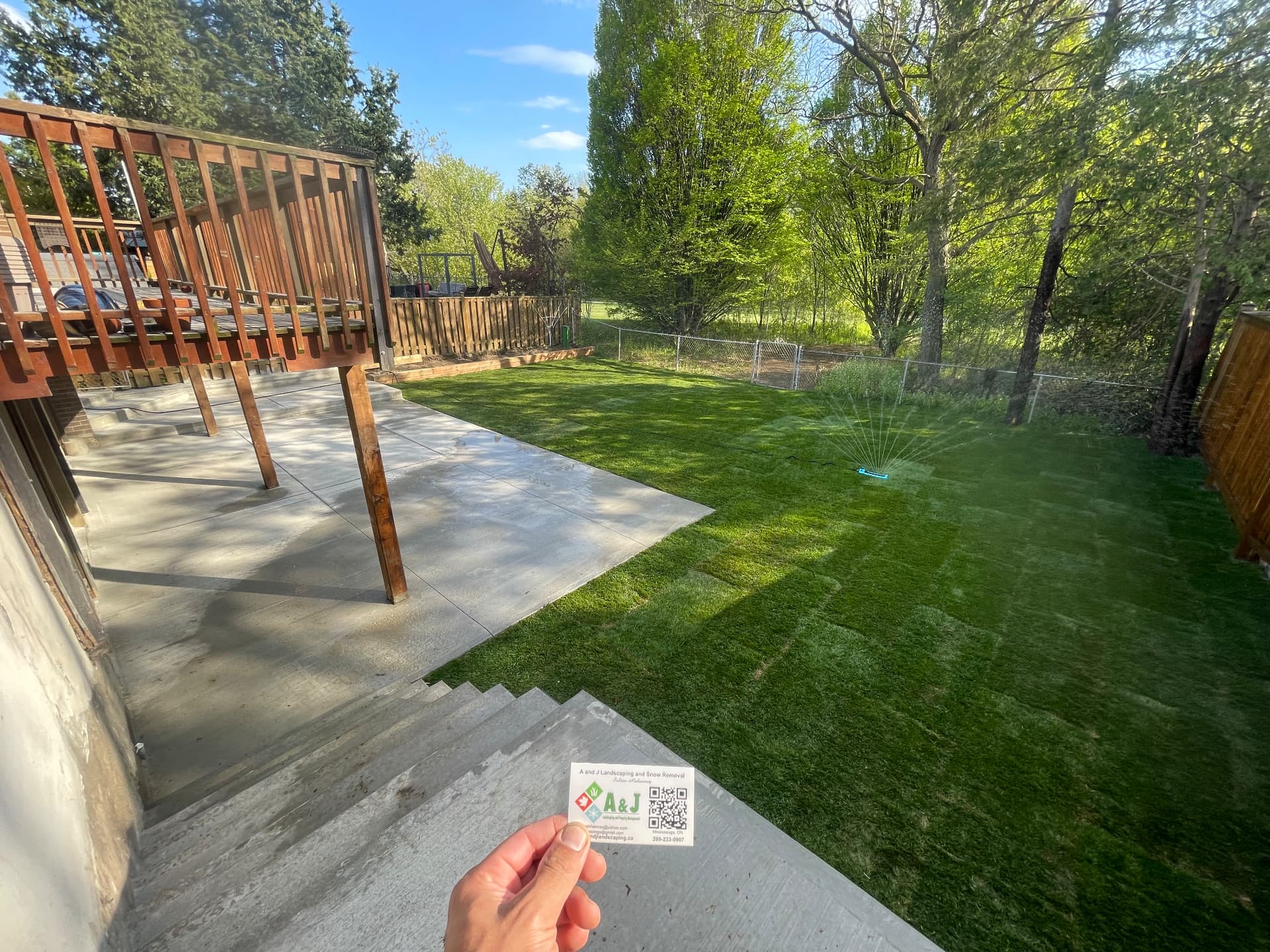 New sod watered after laying