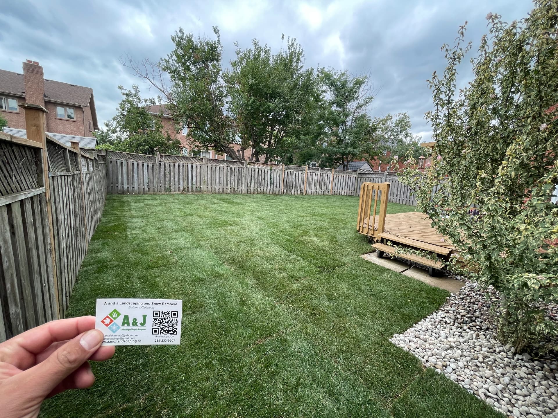 A new lawn beside a raised deck